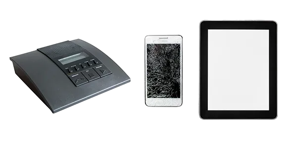 An answering machine, broken mobile phone and tablet