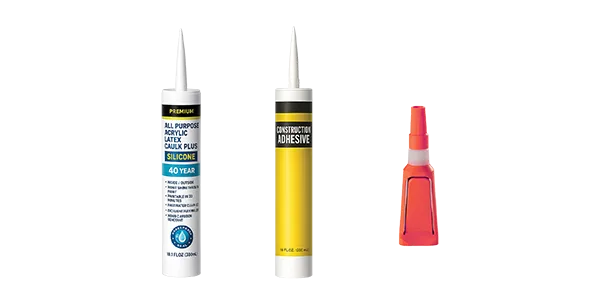 A tube of caulk, a tube of wood glue, and a small red glue